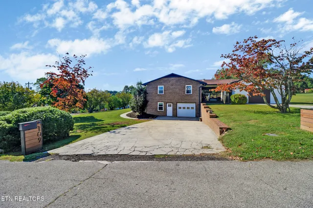 an aerial view of residential house with outdoor space and swimming pool