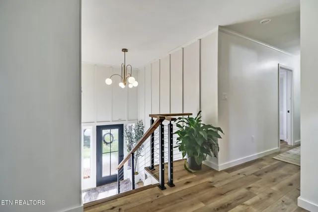 a view of an entryway with wooden floor