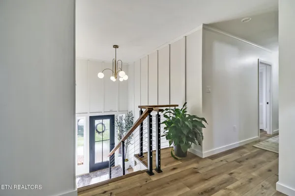 a bathroom with a sink a toilet a mirror and shower curtain