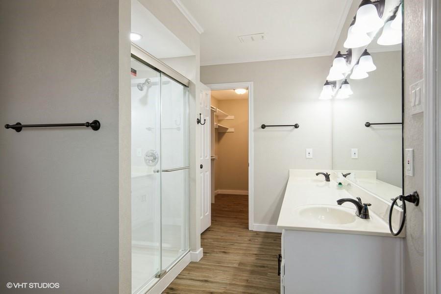 19179 State Highway 64 Canton, TX 75103 - Photo 13 of 15 a bathroom with a sink a mirror and a shower