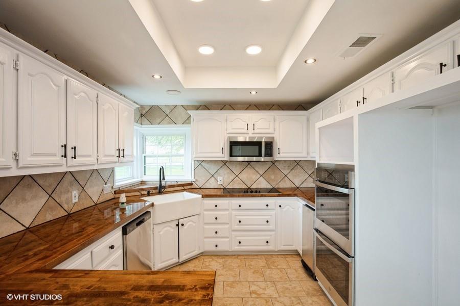 19179 State Highway 64 Canton, TX 75103 - Photo 7 of 15 a kitchen with granite countertop a stove sink and cabinets