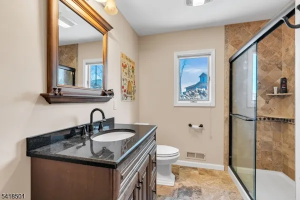 a bedroom with a bed and with flat screen tv
