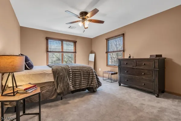 a bed room with a bed and a large window