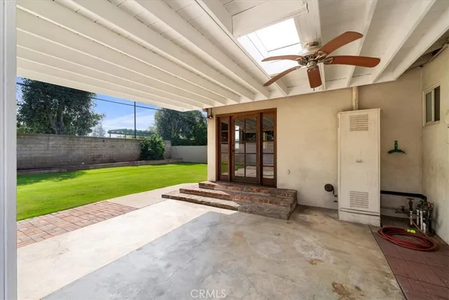 a view of a backyard with swimming pool