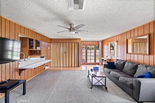 a kitchen with stainless steel appliances a refrigerator sink and cabinets