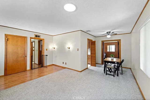 an empty room with furniture and a window