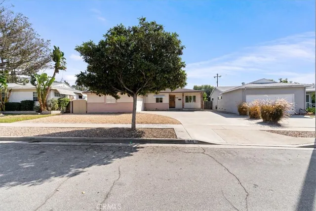 a house view with a backyard space