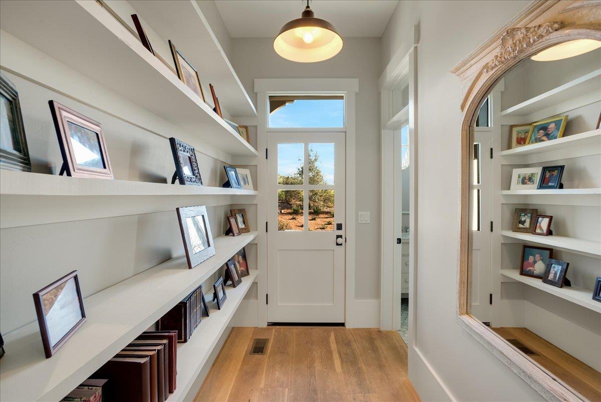 7670 Crews Road Gilroy, CA 95020 - Photo 52 of 83 a view of a hallway with wooden cabinet and floors