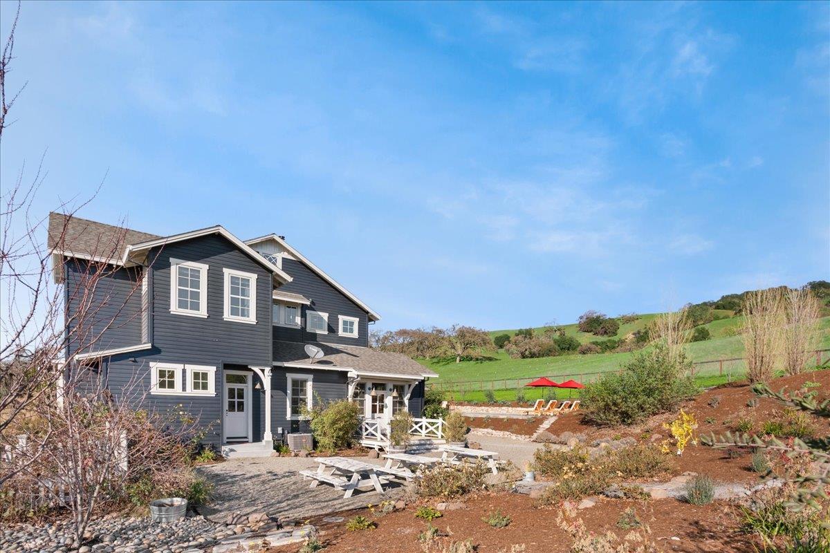 7670 Crews Road Gilroy, CA 95020 - Photo 60 of 83 a front view of a house with a yard and lake view