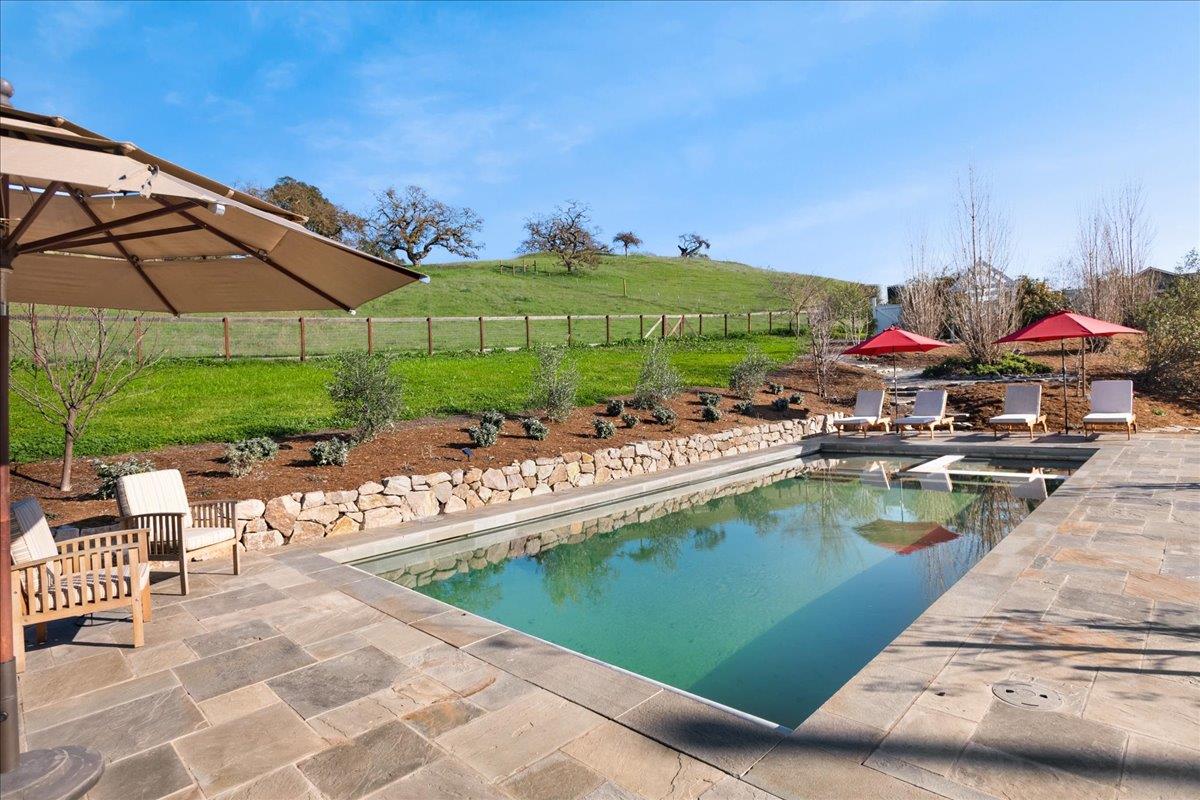 7670 Crews Road Gilroy, CA 95020 - Photo 75 of 83 a view of a swimming pool with a lounge chairs