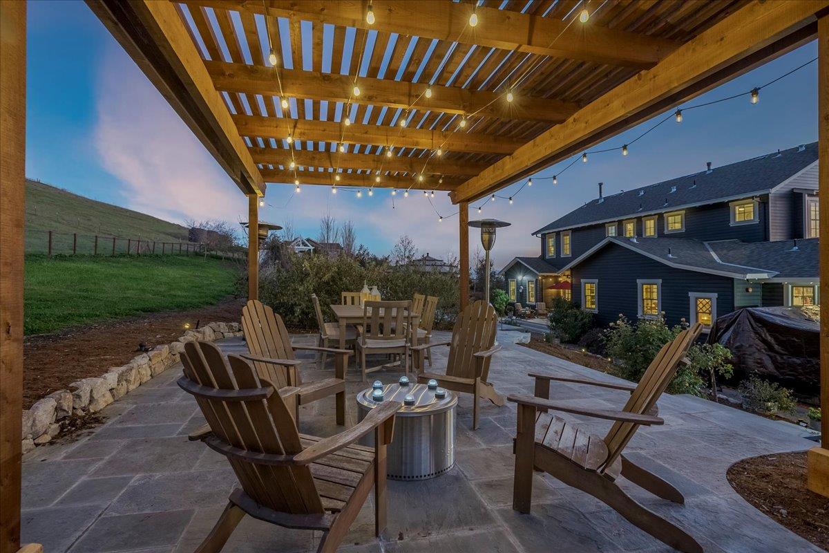 7670 Crews Road Gilroy, CA 95020 - Photo 77 of 83 a view of a patio with a table chairs and a backyard