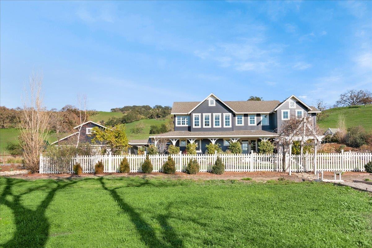 7670 Crews Road Gilroy, CA 95020 - Photo 10 of 83 a front view of a house with a yard and deck