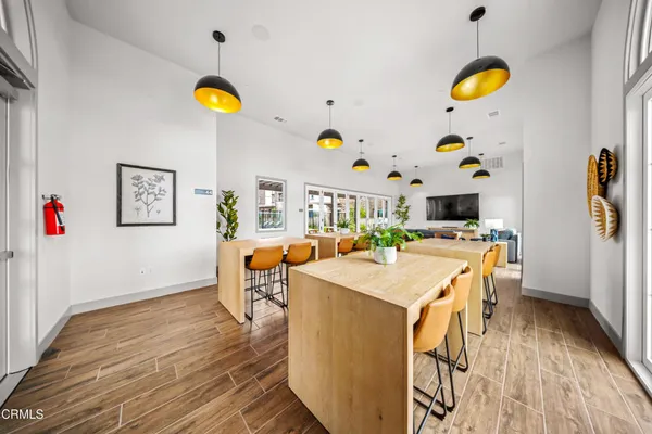 a living room with dining table and chairs