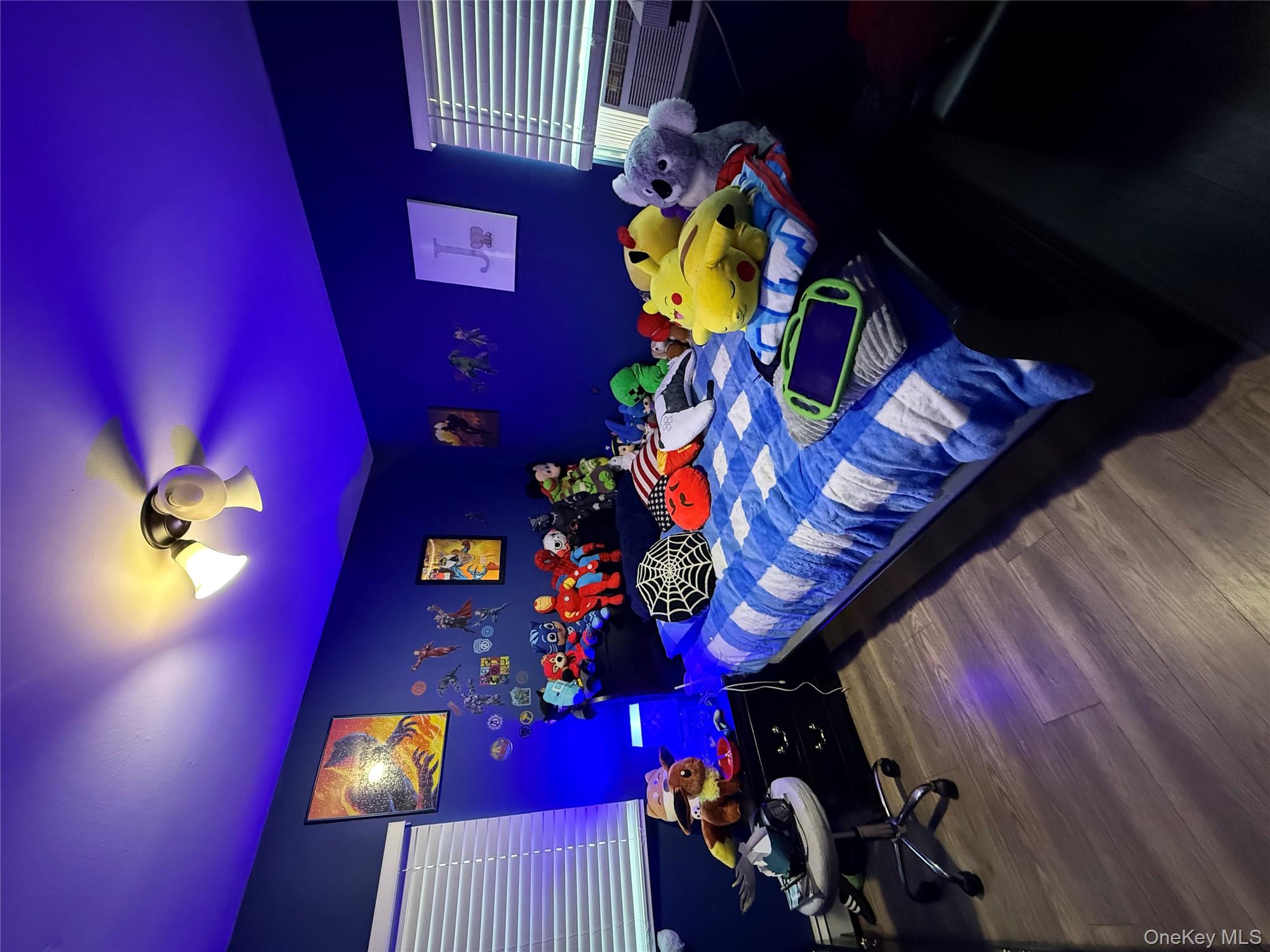 17 Hampton Road Shirley, NY 11967 - Photo 12 of 26 a bedroom with furniture and chandelier