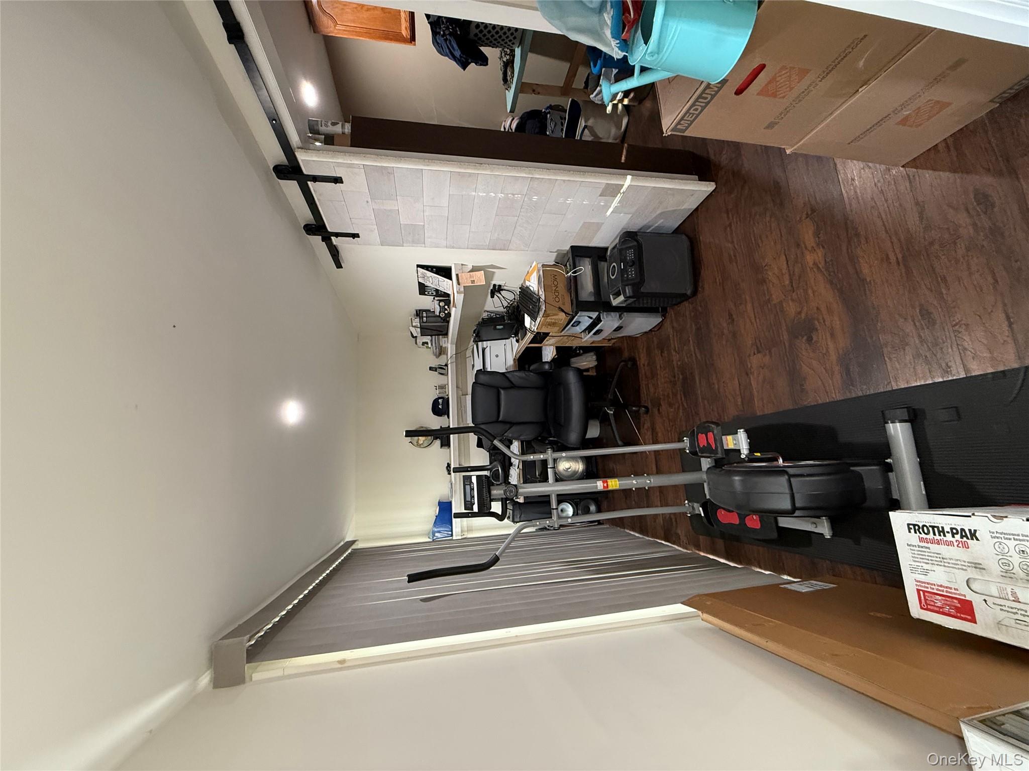 17 Hampton Road Shirley, NY 11967 - Photo 14 of 26 a view of a room with gym equipment