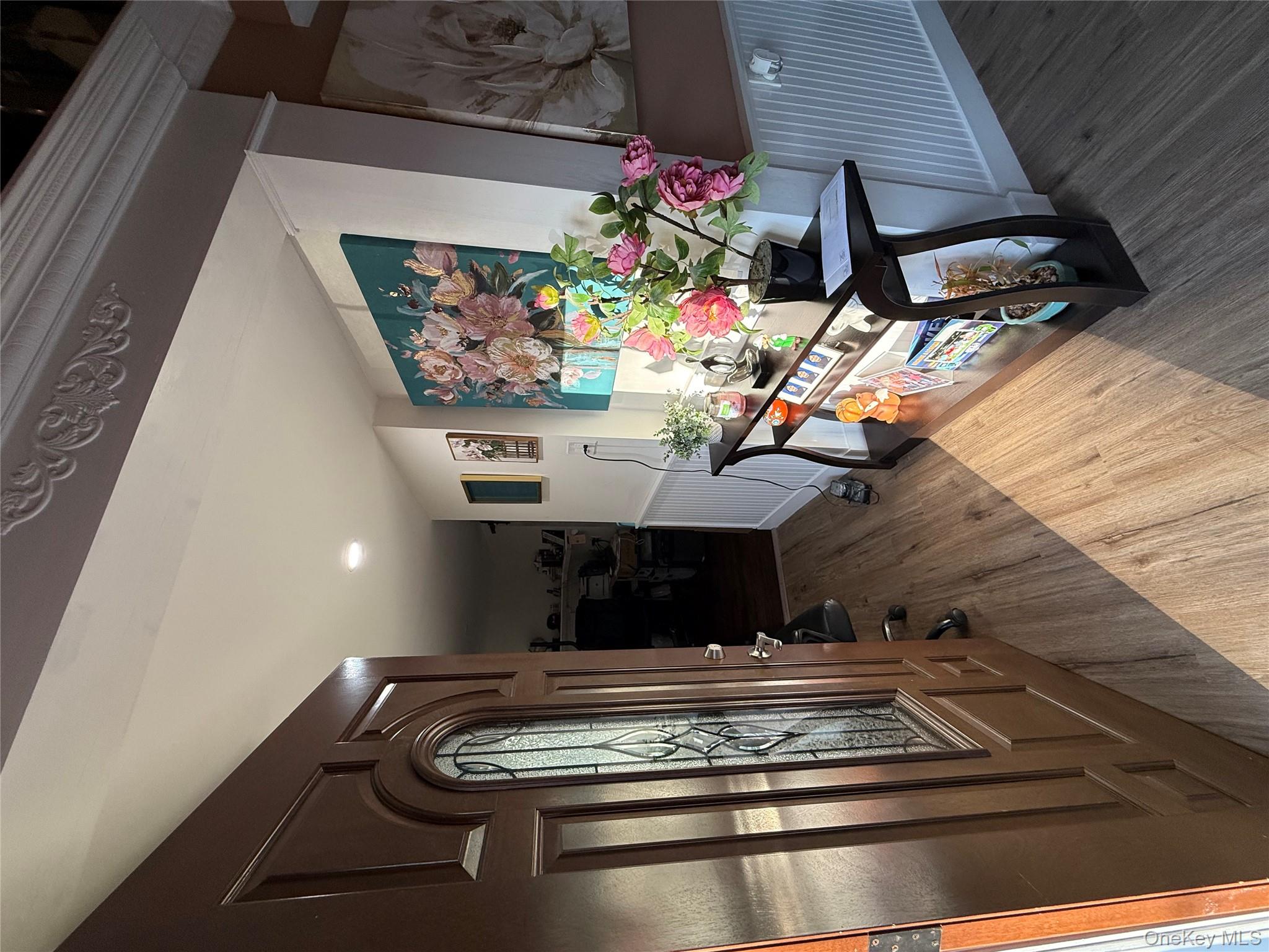 17 Hampton Road Shirley, NY 11967 - Photo 16 of 26 a living room with furniture and a potted plant