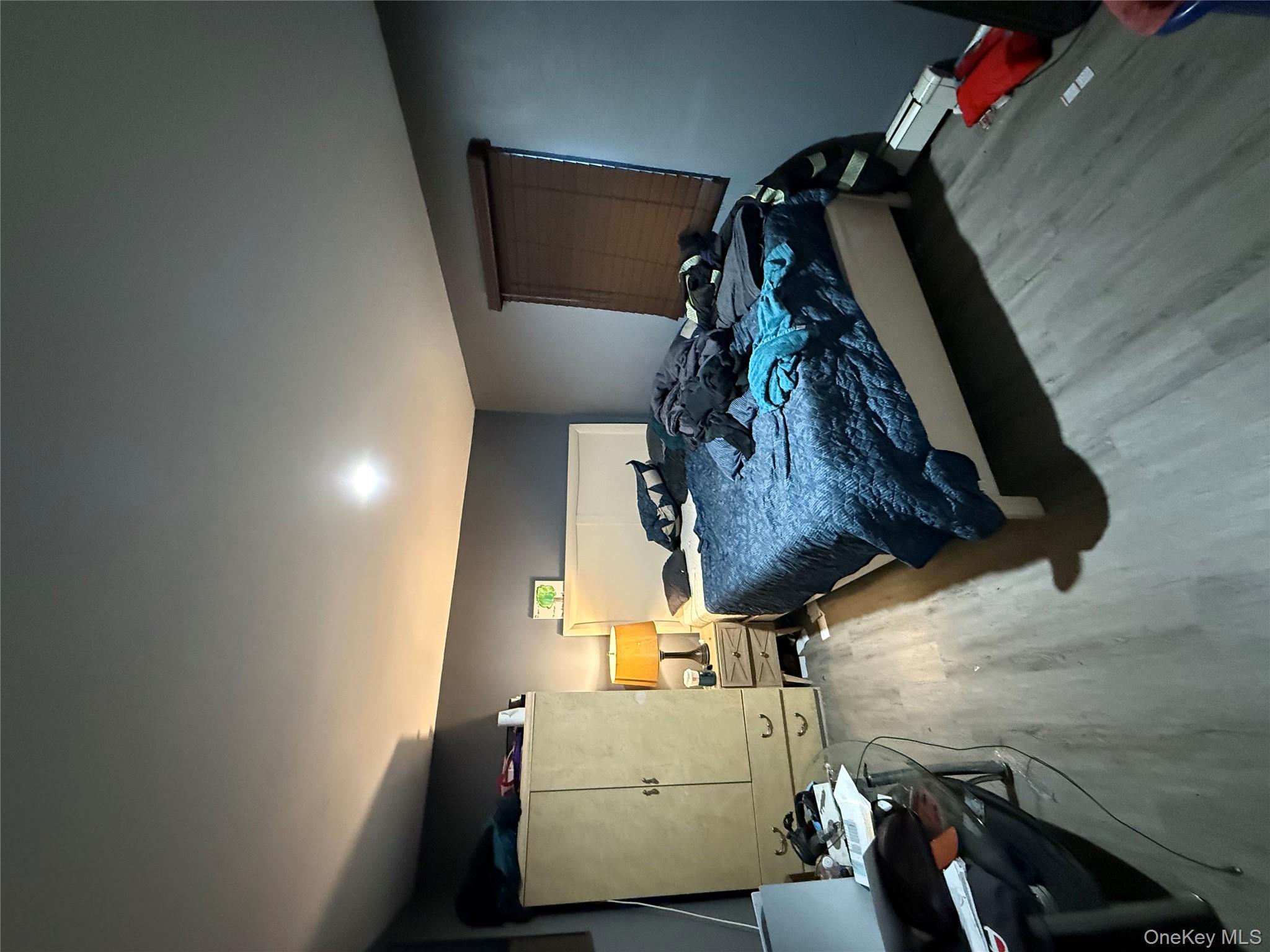 17 Hampton Road Shirley, NY 11967 - Photo 20 of 26 a bedroom with a bed and a walk in closet