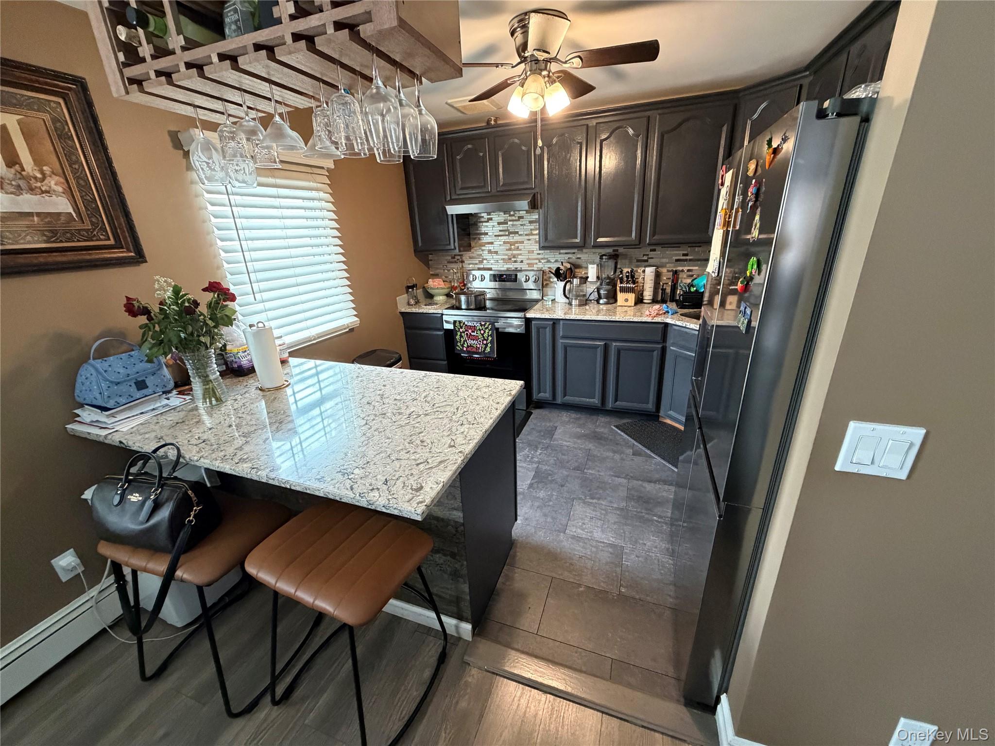 17 Hampton Road Shirley, NY 11967 - Photo 7 of 26 a kitchen with a table and chairs