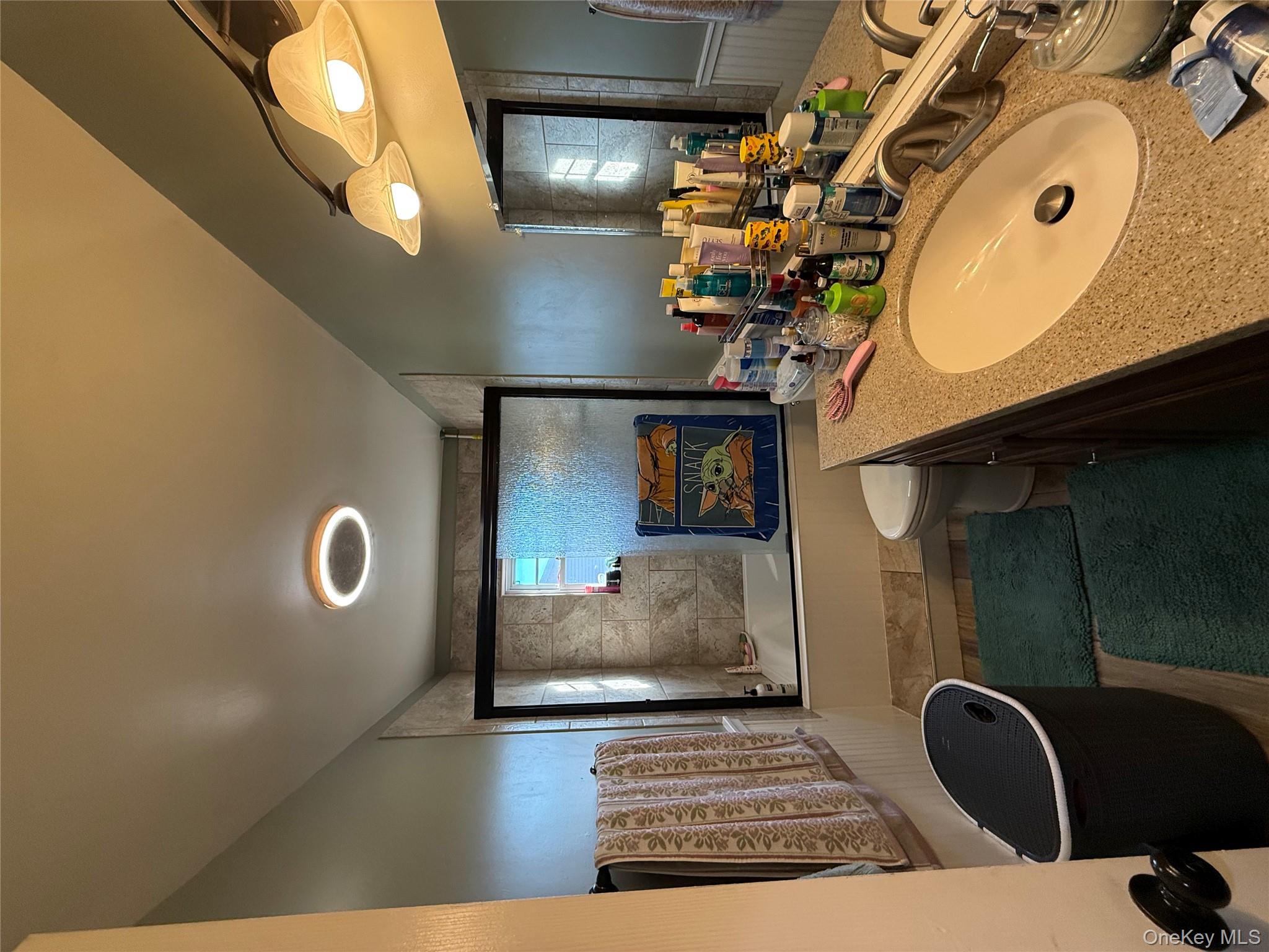 17 Hampton Road Shirley, NY 11967 - Photo 9 of 26 a bathroom with a granite countertop sink and a large mirror