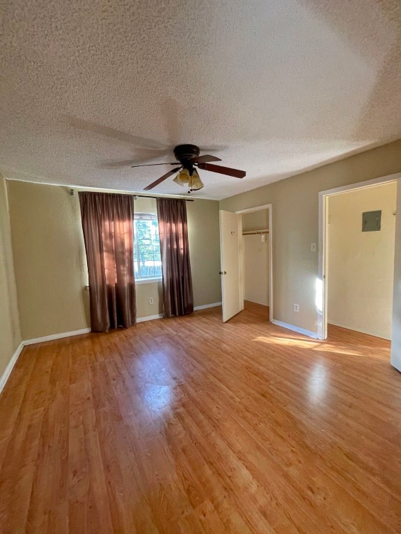 2800 Jeanetta Street, Unit 1110 Houston, TX 77063 - Photo 2 of 6 a view of an empty room with wooden floor and window