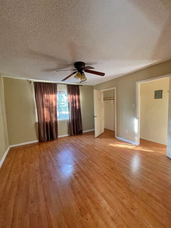2800 Jeanetta Street, Unit 1110 Houston, TX 77063 - Photo 4 of 6 a view of an empty room with wooden floor and window