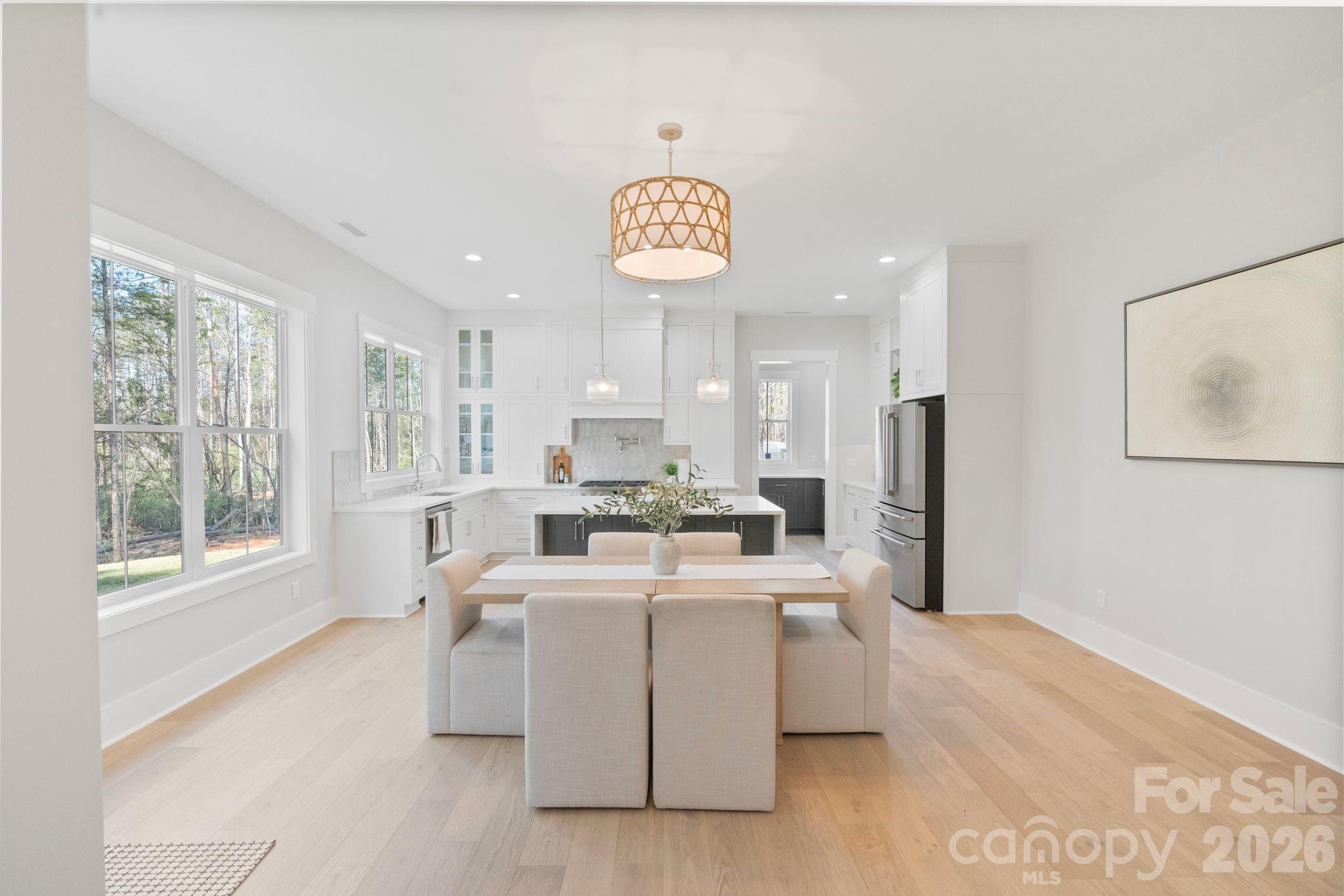 568 Longleaf Pine Lane Clover, SC 29710 - Photo 12 of 48 a view of a kitchen with center island stainless steel appliances wooden floor and window