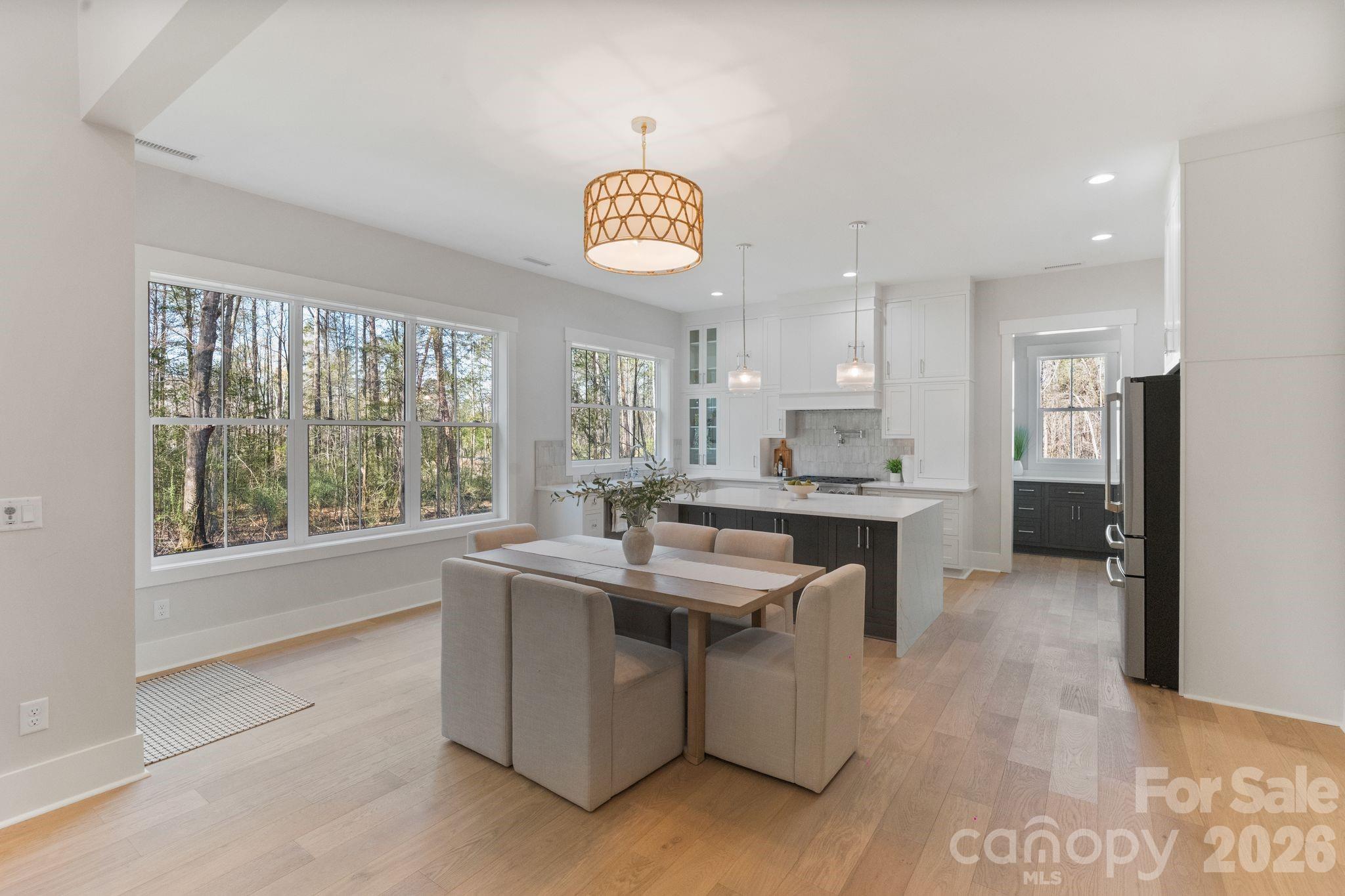 568 Longleaf Pine Lane Clover, SC 29710 - Photo 13 of 48 a kitchen with kitchen island granite countertop a sink stove and cabinets