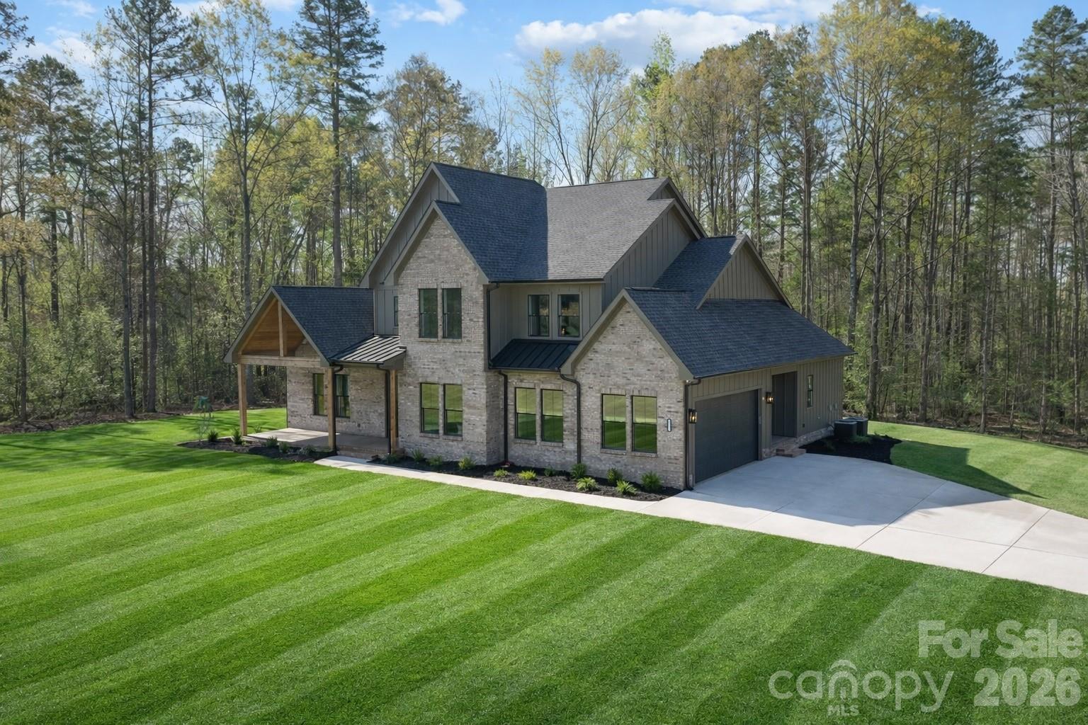 568 Longleaf Pine Lane Clover, SC 29710 - Photo 2 of 48 a front view of house with yard and green space