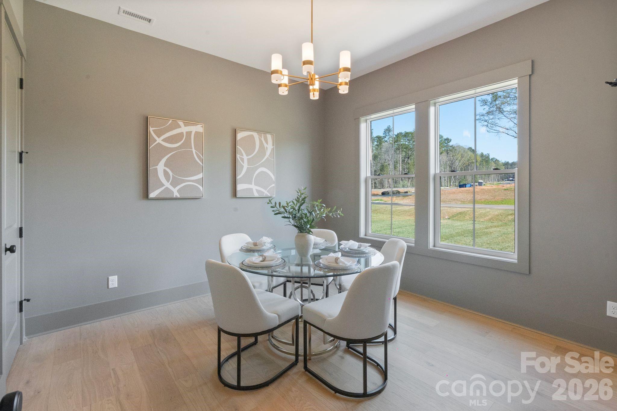 568 Longleaf Pine Lane Clover, SC 29710 - Photo 24 of 48 a dining room with furniture a chandelier and window