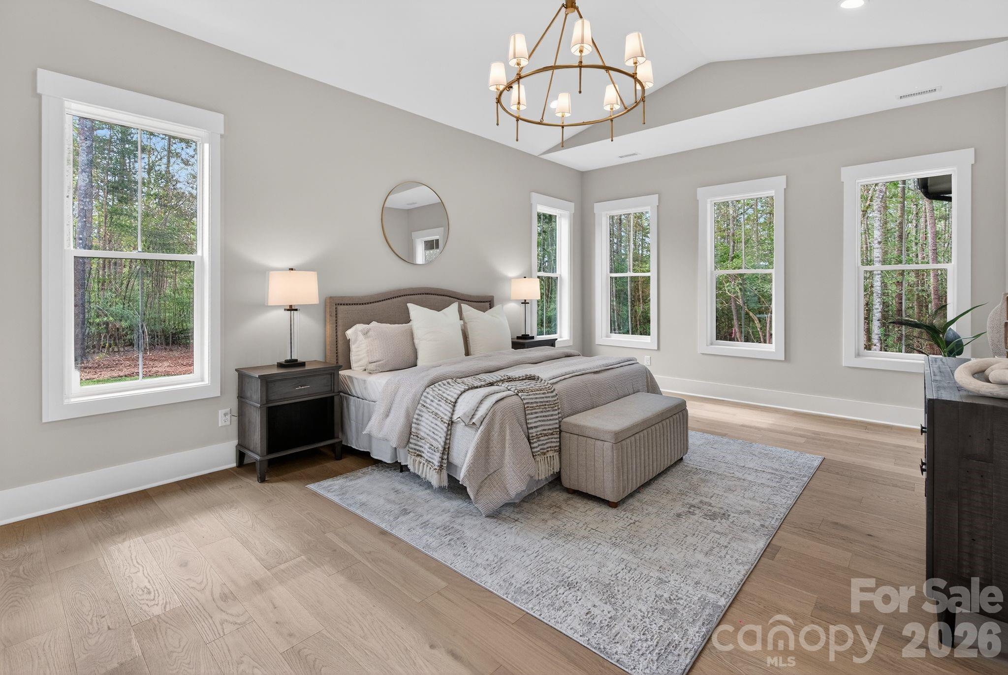 568 Longleaf Pine Lane Clover, SC 29710 - Photo 26 of 48 a spacious bedroom with a bed and a large window