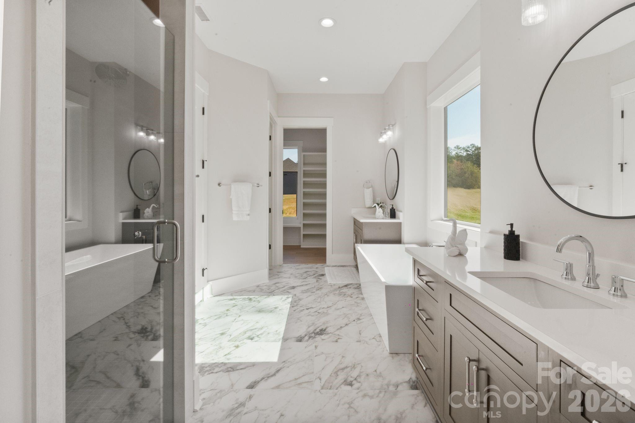568 Longleaf Pine Lane Clover, SC 29710 - Photo 27 of 48 a spacious bathroom with a tub sink and mirror