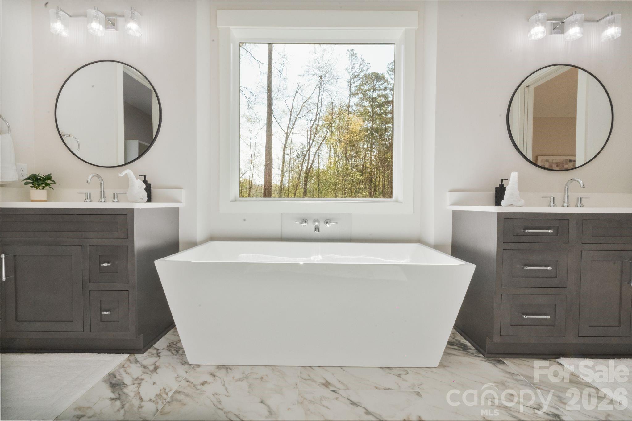 568 Longleaf Pine Lane Clover, SC 29710 - Photo 28 of 48 a spacious bathroom with a tub and a mirror