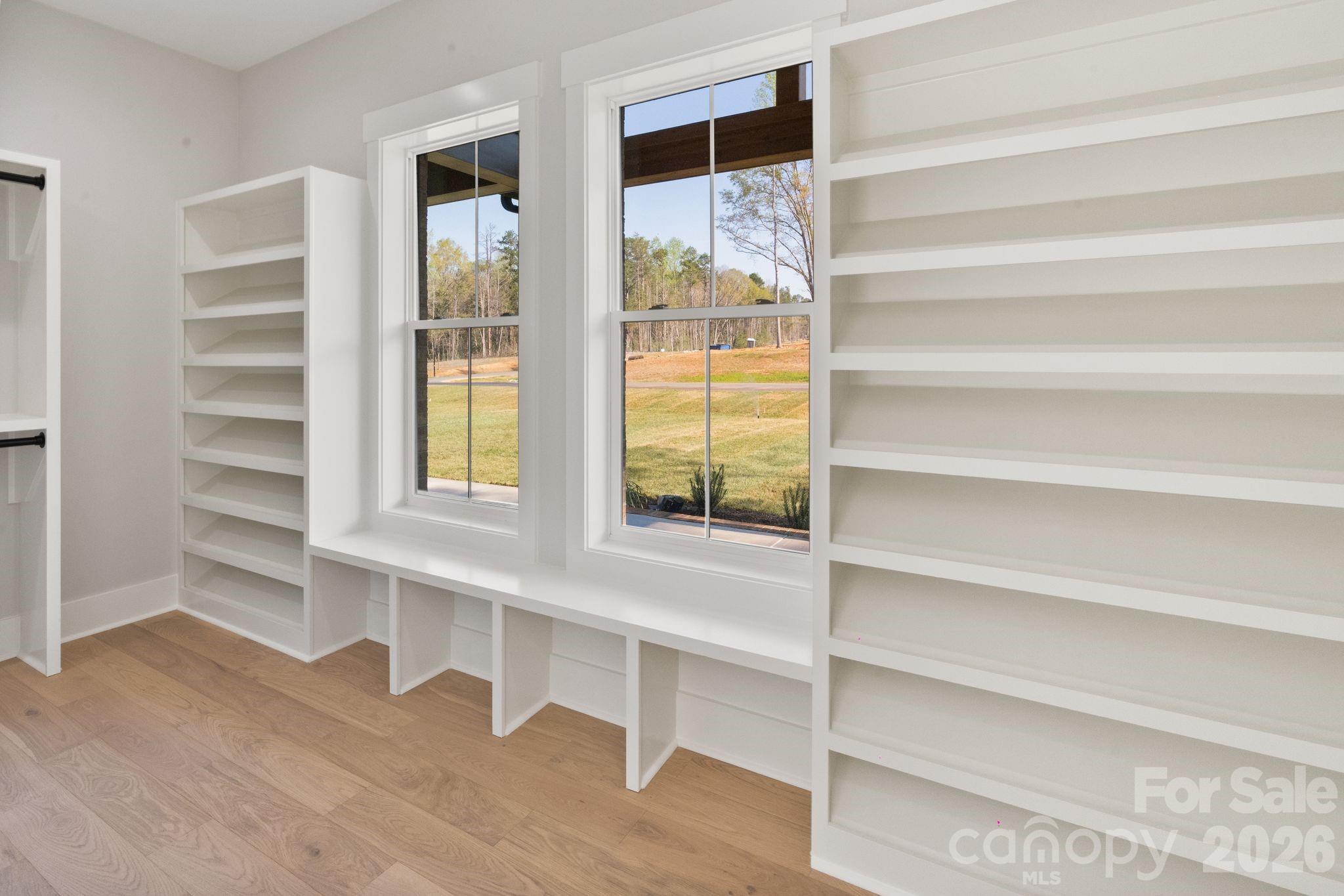 568 Longleaf Pine Lane Clover, SC 29710 - Photo 31 of 48 a view of walk in closet with empty racks