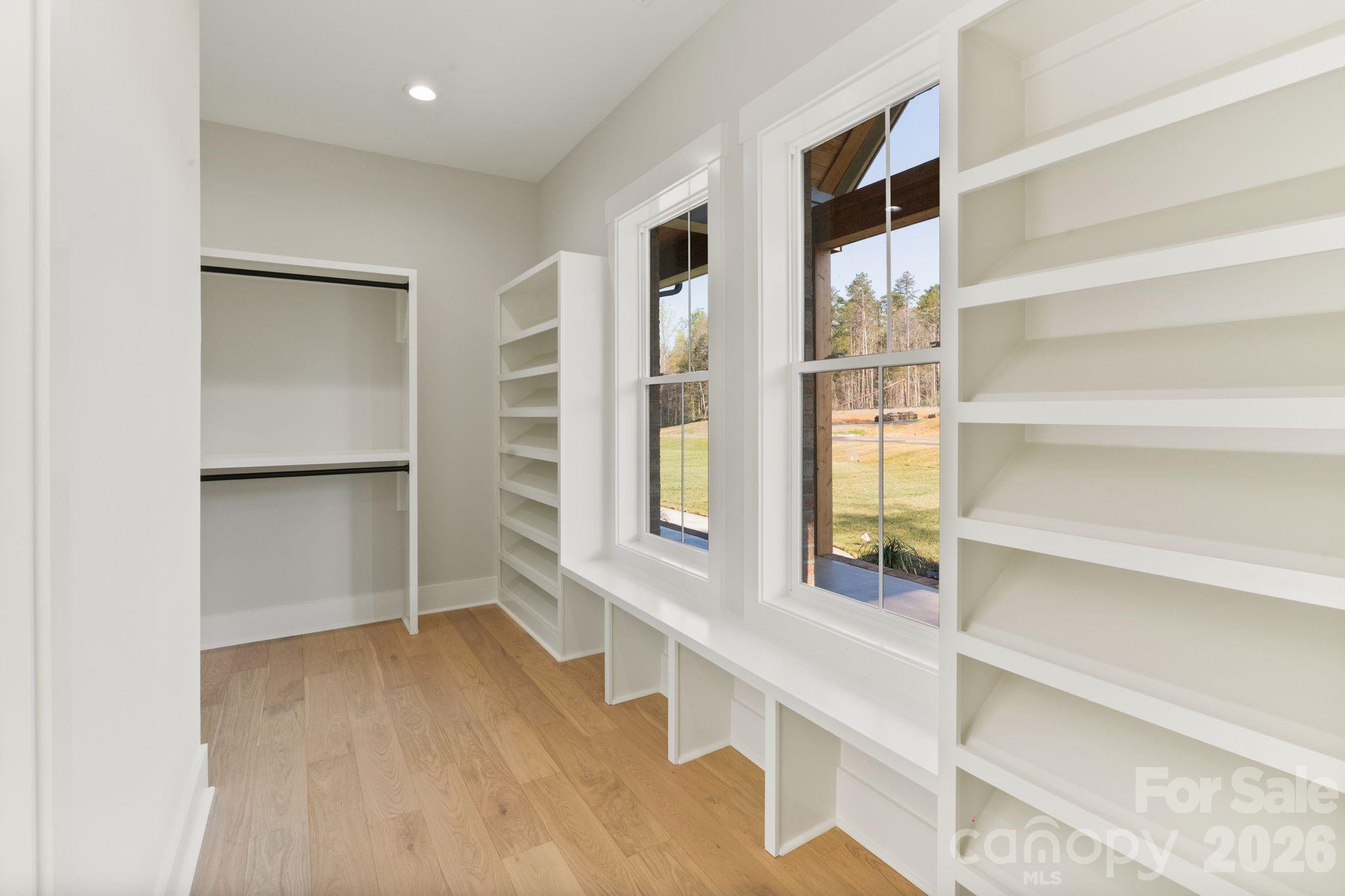 568 Longleaf Pine Lane Clover, SC 29710 - Photo 32 of 48 a view of walk in closet with empty racks