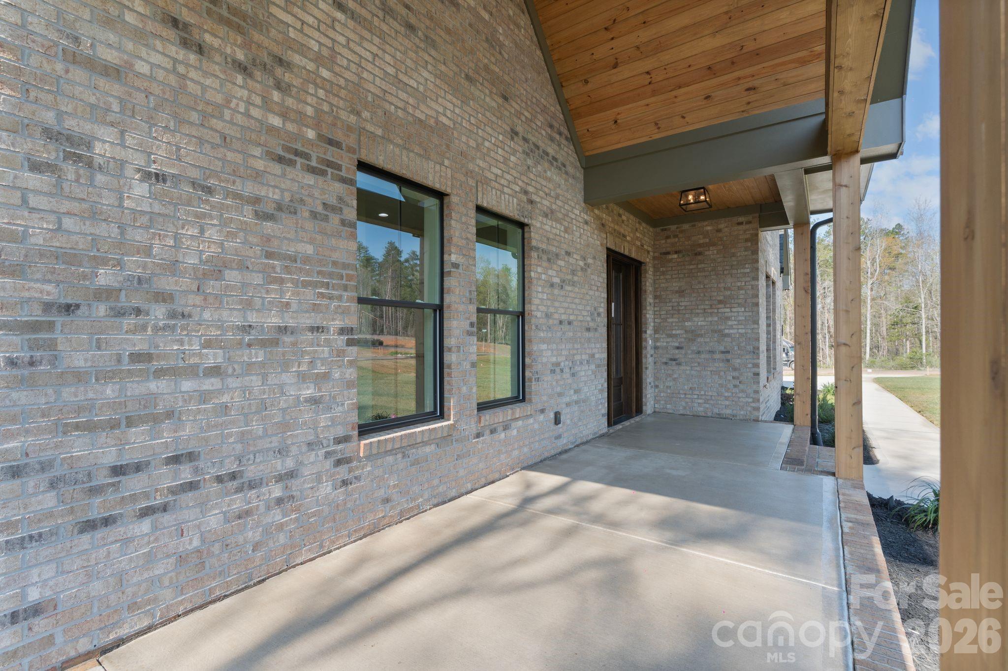 568 Longleaf Pine Lane Clover, SC 29710 - Photo 37 of 48 a view of a brick house with a large windows