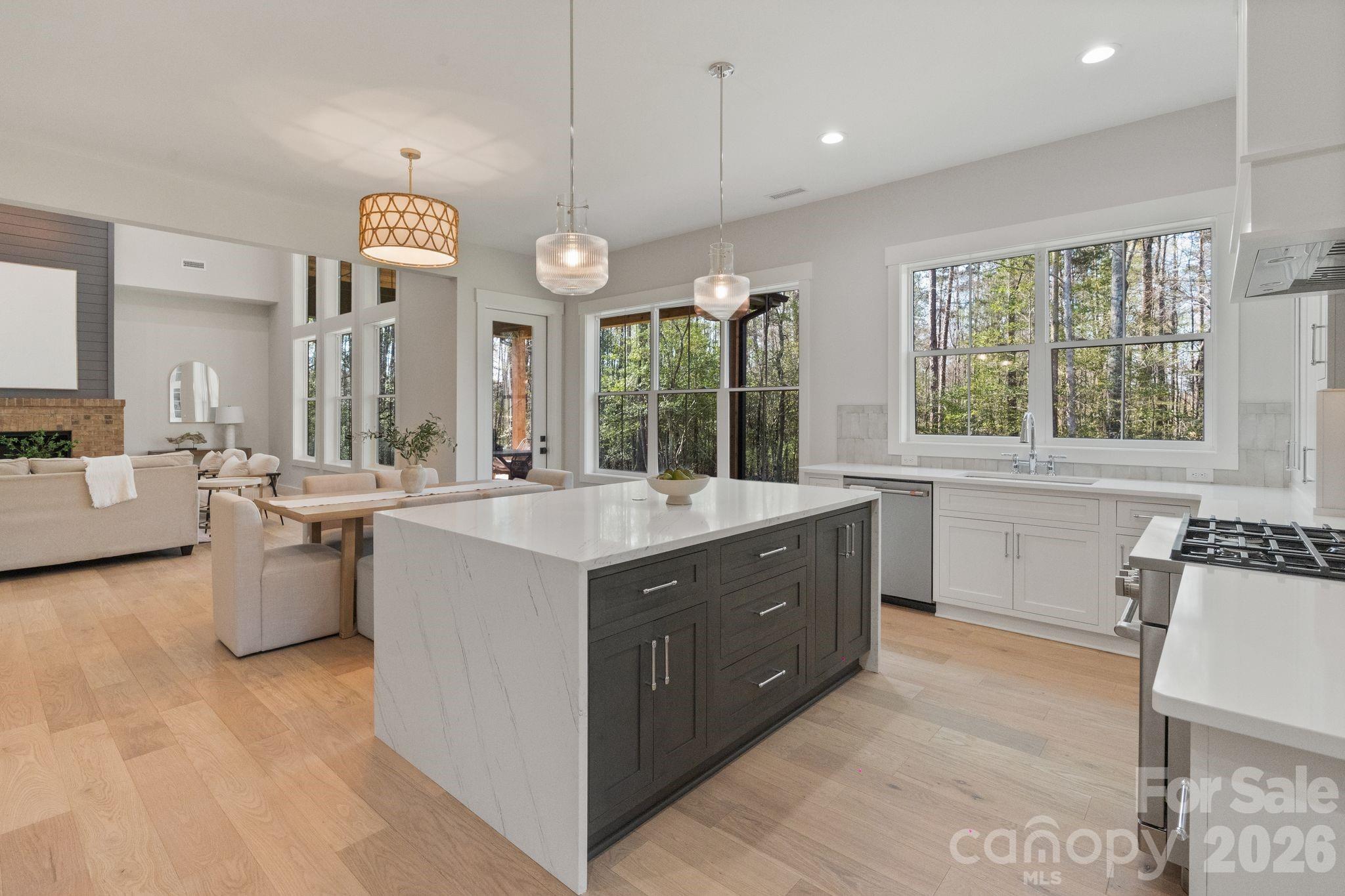 568 Longleaf Pine Lane Clover, SC 29710 - Photo 8 of 48 a large kitchen with a large window and white cabinets