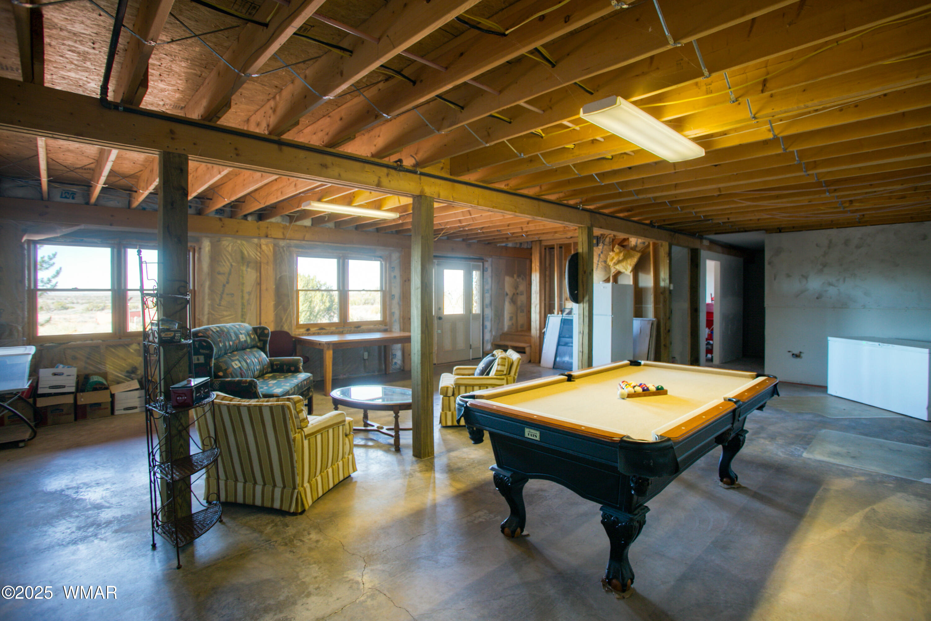 8555 Reata Lane Snowflake, AZ 85937 - Photo 38 of 88 a living room with furniture pool table and chandelier