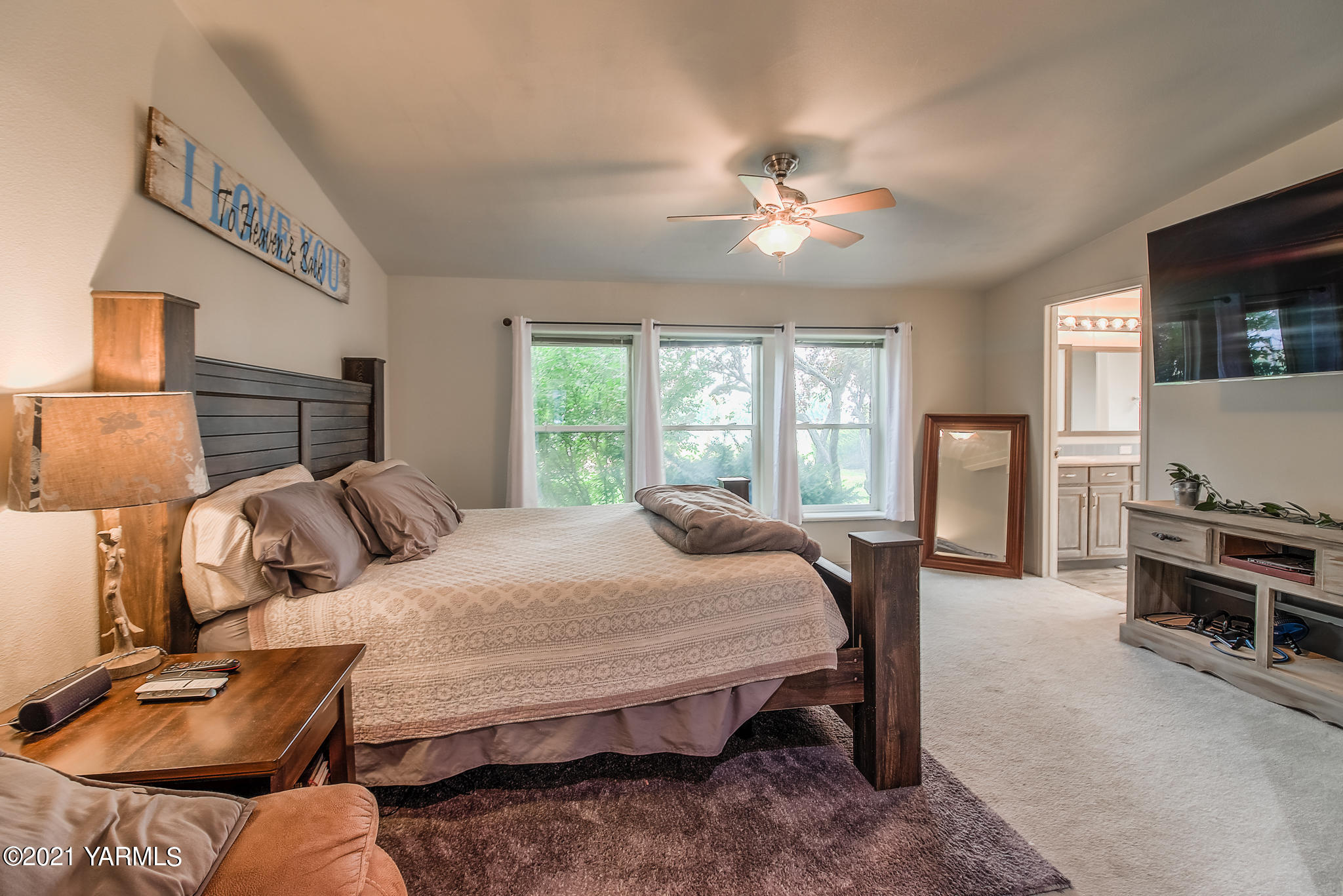 251 Wellner Road Outlook, WA 98938 - Photo 22 of 45 a bedroom with a bed and wooden floor