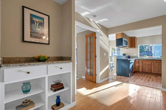 a kitchen with stainless steel appliances granite countertop a refrigerator and a stove