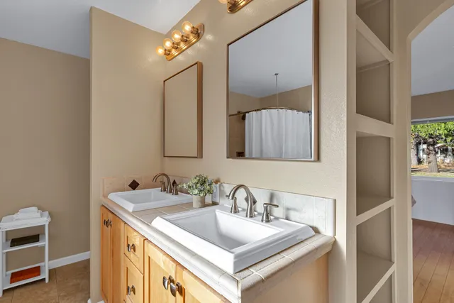 a bathroom with a sink and a mirror