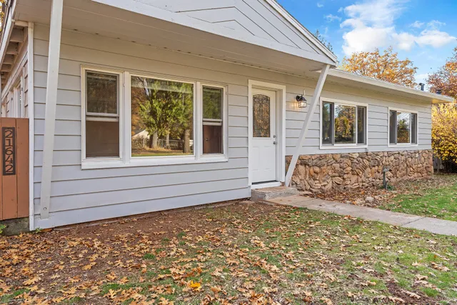 a view of house with backyard