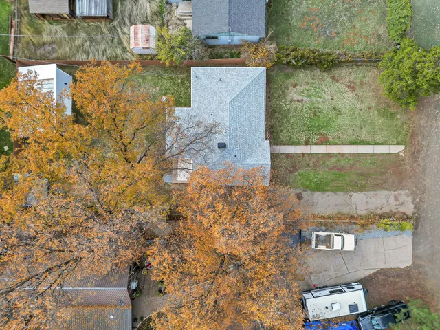 an aerial view of residential houses with outdoor space