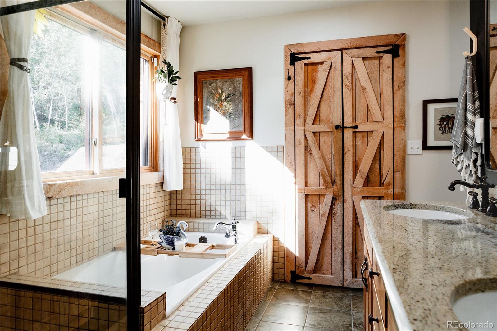 13574 Baird Road Conifer, CO 80433 - Photo 14 of 50 a view of a living room and bathroom