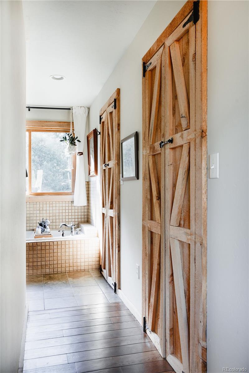 13574 Baird Road Conifer, CO 80433 - Photo 17 of 50 a walk in closet with a window