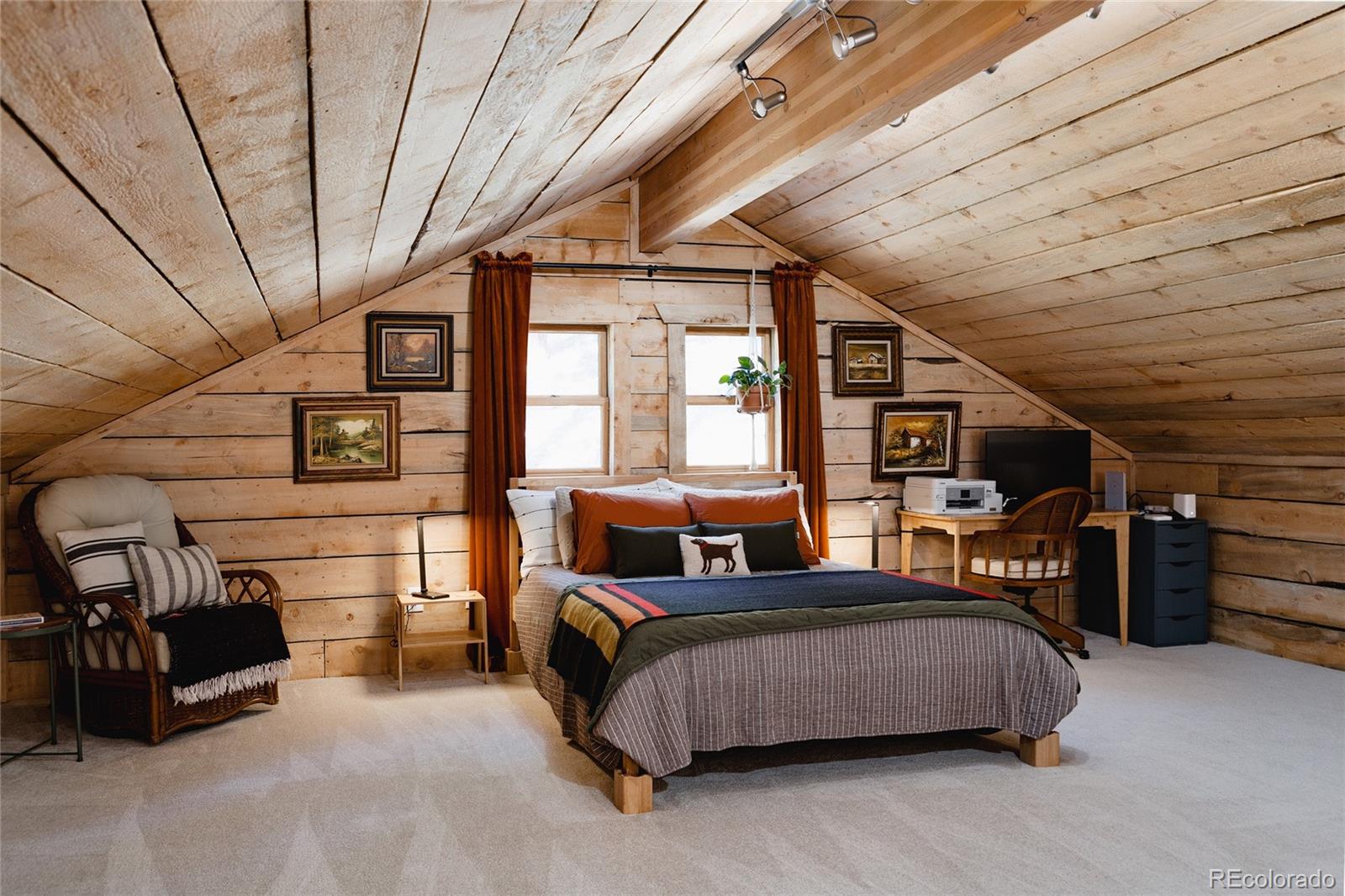 13574 Baird Road Conifer, CO 80433 - Photo 18 of 50 a bed room with a bed and a large window