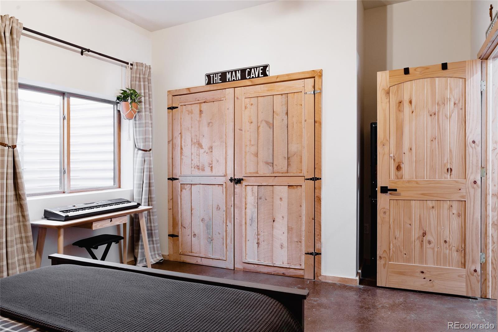 13574 Baird Road Conifer, CO 80433 - Photo 26 of 50 an entryway with wooden floor