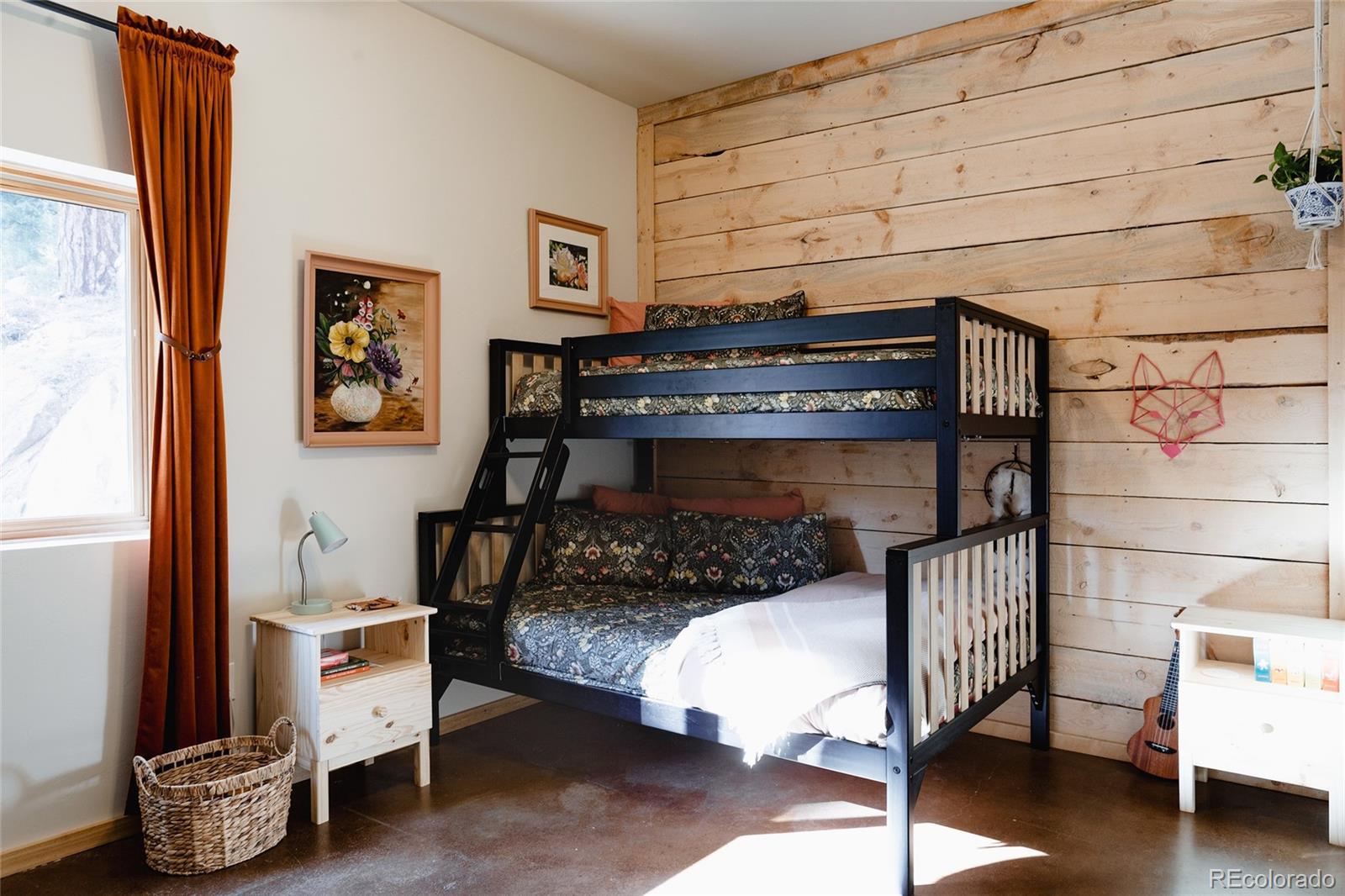 13574 Baird Road Conifer, CO 80433 - Photo 28 of 50 a bedroom with a bed and a window