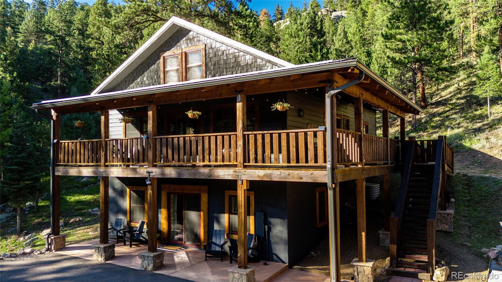 13574 Baird Road Conifer, CO 80433 - Photo 35 of 50 a front view of a house with balcony
