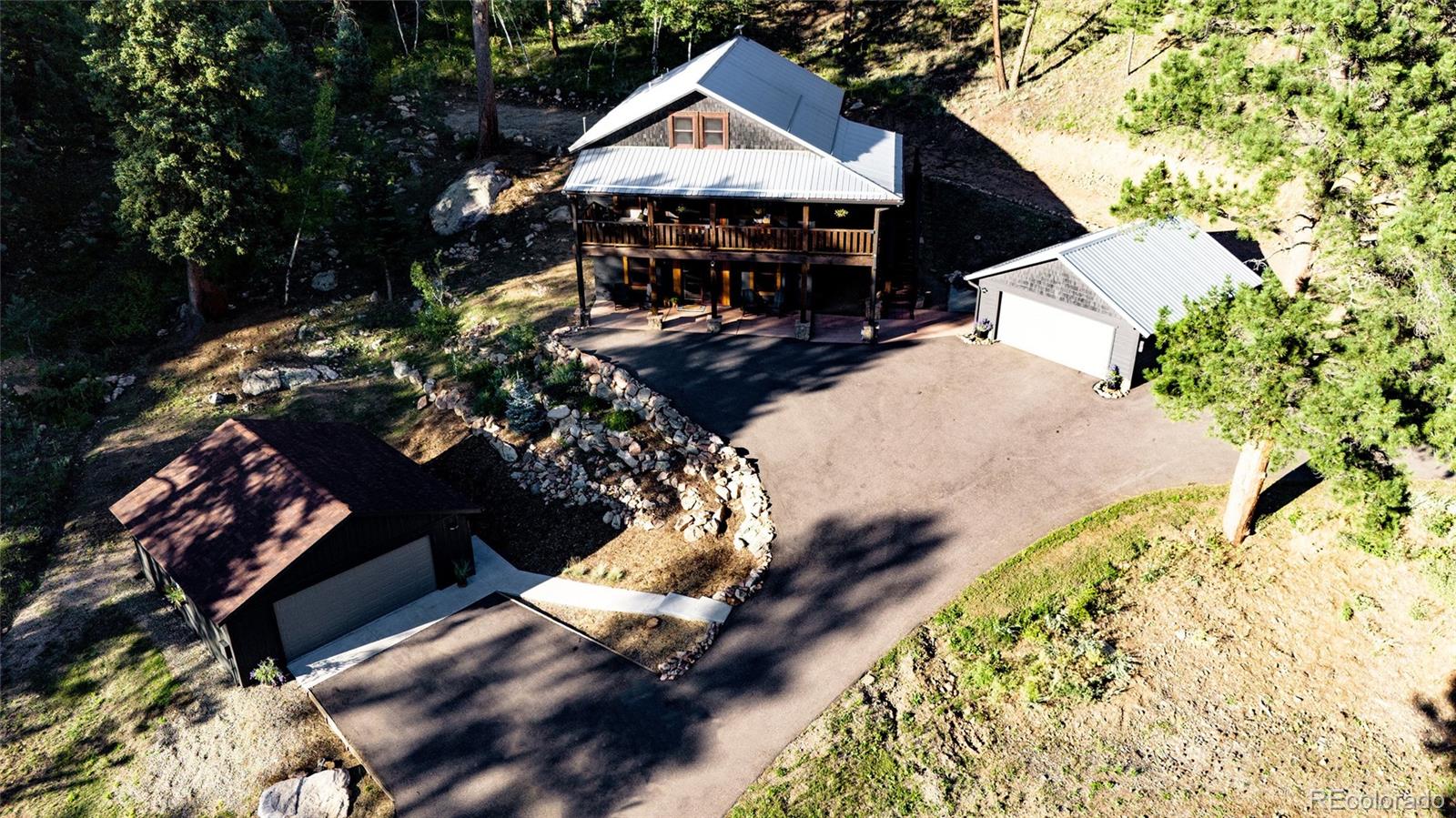 13574 Baird Road Conifer, CO 80433 - Photo 46 of 50 an outdoor space with seating area
