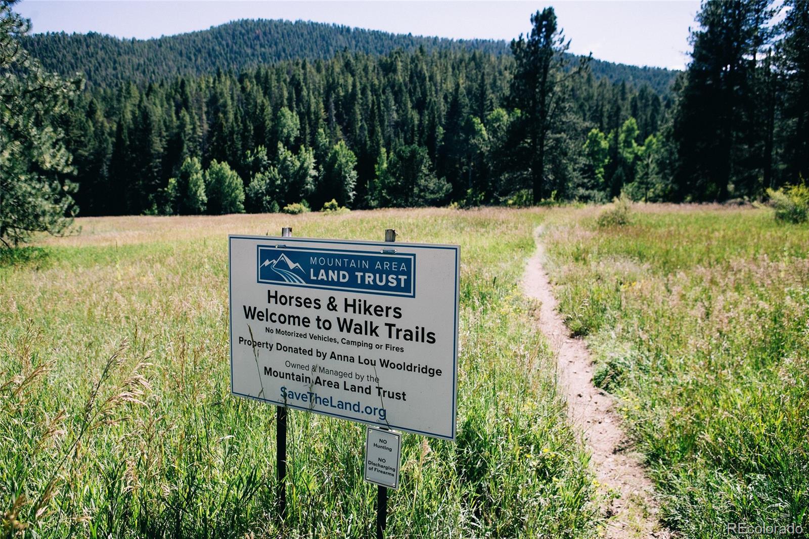 13574 Baird Road Conifer, CO 80433 - Photo 48 of 50 a view of a sign in front of a building